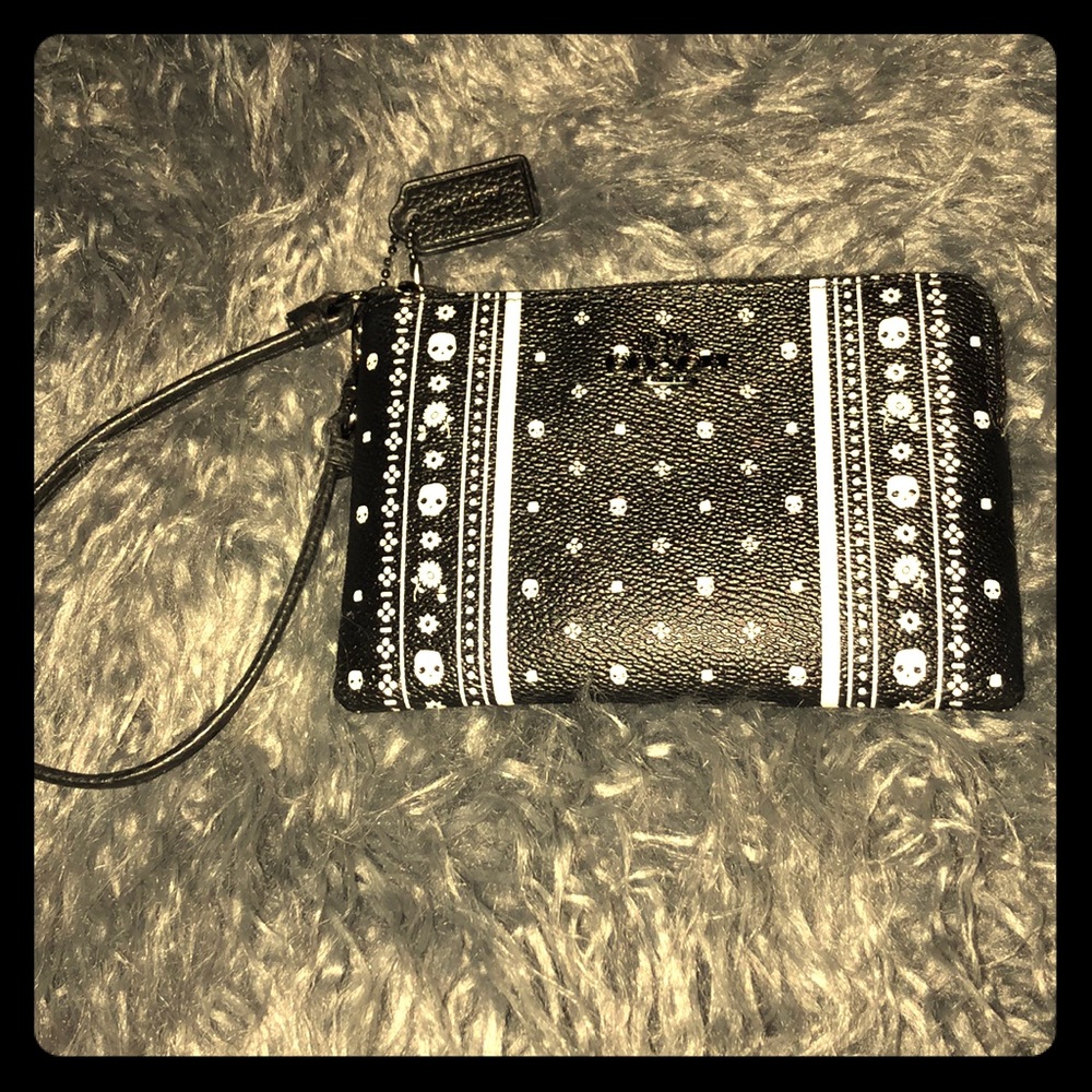 Authentic Coach Wristlet skull/flower pattern